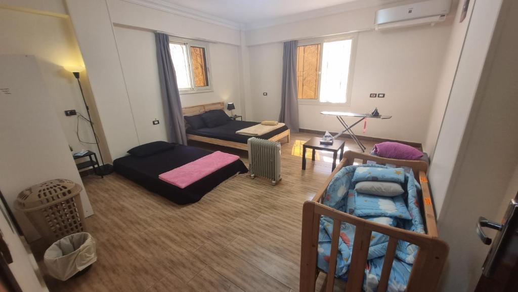 a living room with two bunk beds and a couch at New Cairo Luxury Apartment in luxury villa basement in Cairo