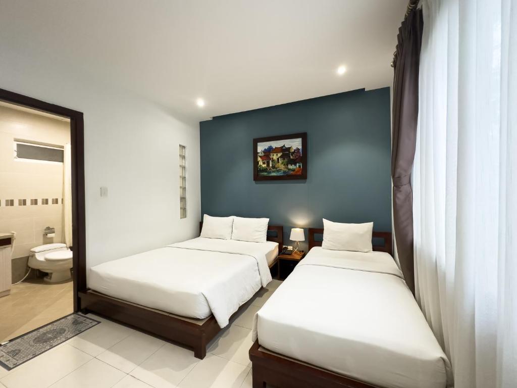 Hoang Yen Hotel - Phu My Hung - Верхняя тройная комната