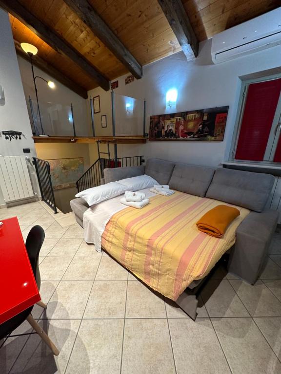 a bedroom with a large bed in a room at La tana di Piozzo in Piozzo