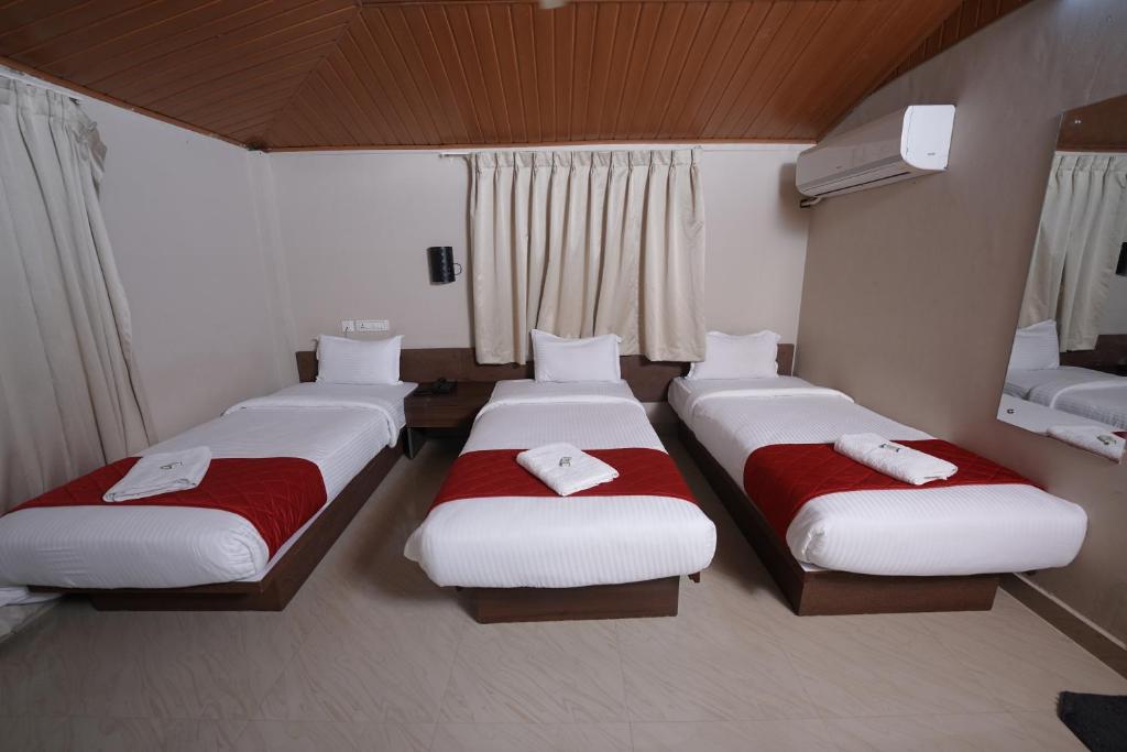Postel nebo postele na pokoji v ubytování DREAMS AIRPORT RESIDENCY