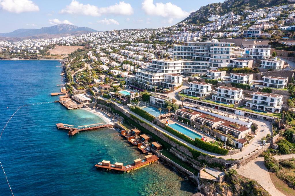 an aerial view of a beach with buildings and the water at Del Mare Reserve Hotel & Spa Bodrum in Bodrum City