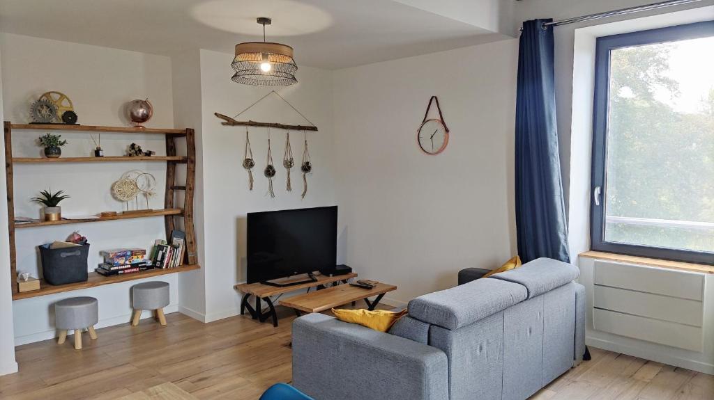 Posezení v ubytování Appartement duplex dans une ancienne usine