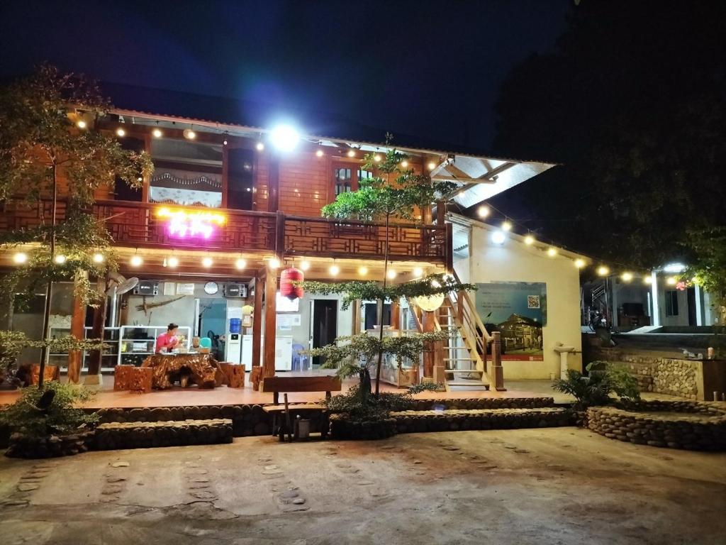 a house with lights on it at night at Homestay and Hots Spring Huy Hường in Yên Bái