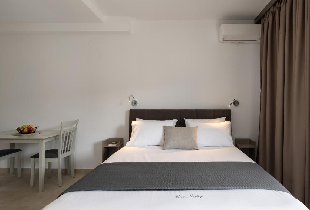 Postel nebo postele na pokoji v ubytování Diva Lodge