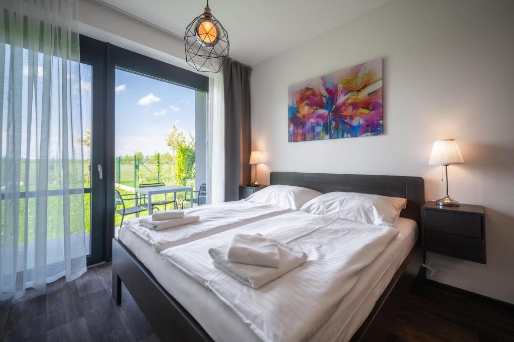Łóżko lub łóżka w pokoju w obiekcie RELAX PARK Třeboň II