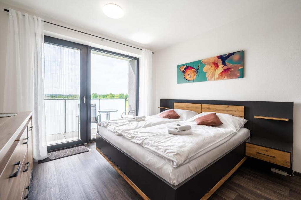 Łóżko lub łóżka w pokoju w obiekcie RELAX PARK Třeboň II