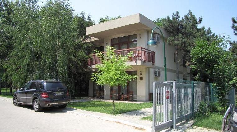 a car parked in front of a house at Vila Codrin Neptun-Olimp in Neptun