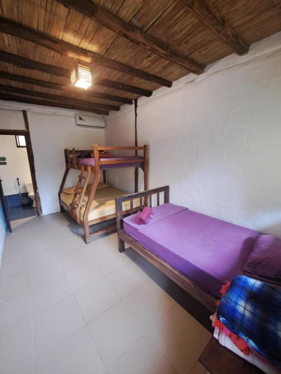 Postel nebo postele na pokoji v ubytování Suites La Tortuga