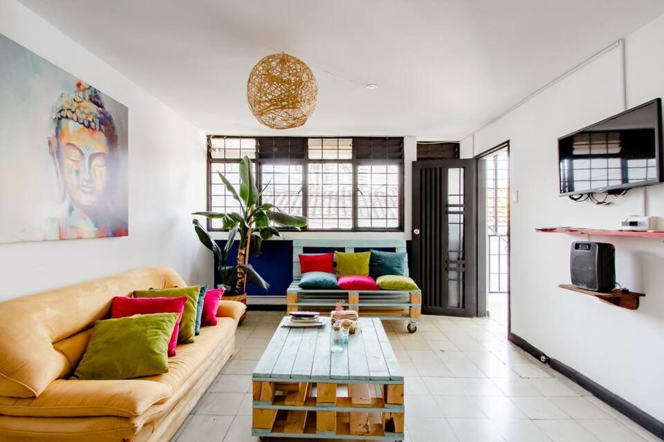 a living room with a couch and a table at Casa de Luz in Cali