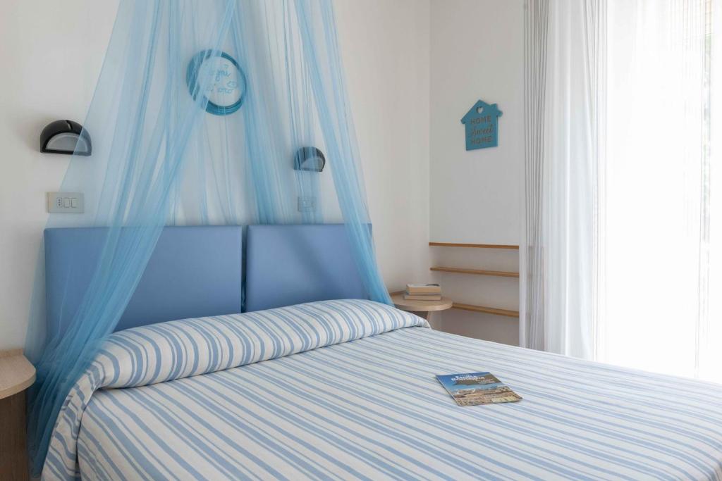 Postel nebo postele na pokoji v ubytování Hotel Smart Cervia B&B