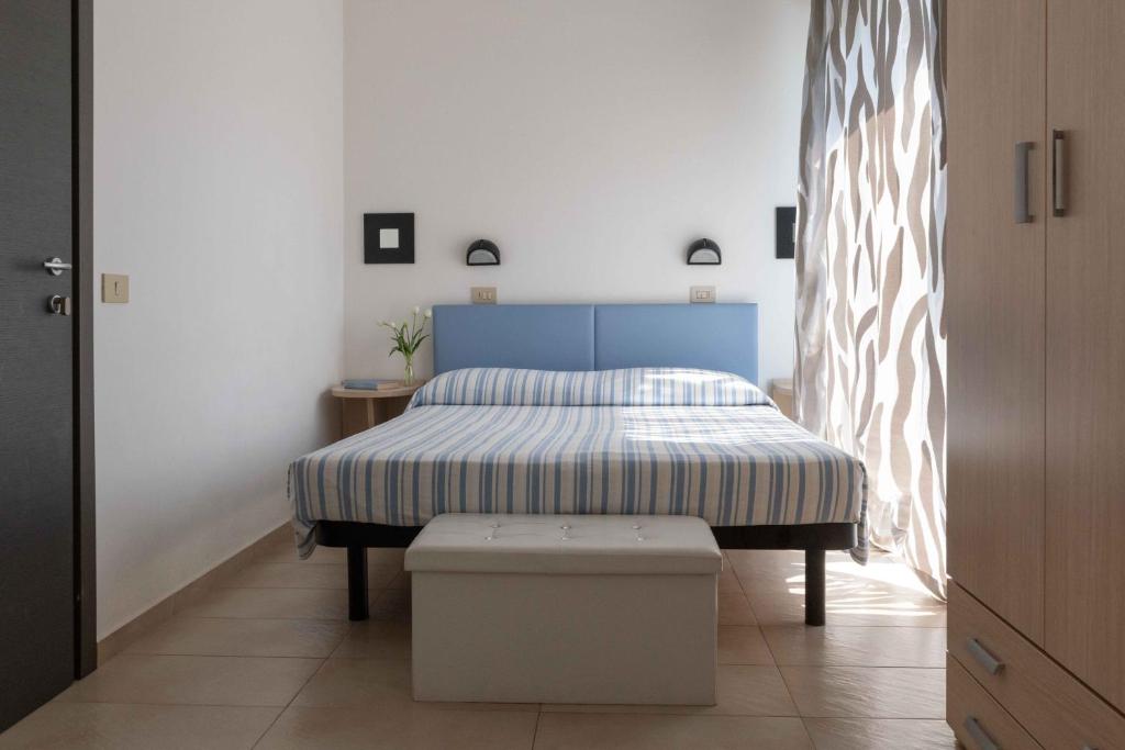 Postel nebo postele na pokoji v ubytování Hotel Smart Cervia B&B