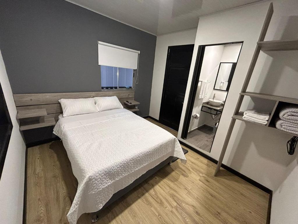 Postel nebo postele na pokoji v ubytování Hostel Quinta Camacho
