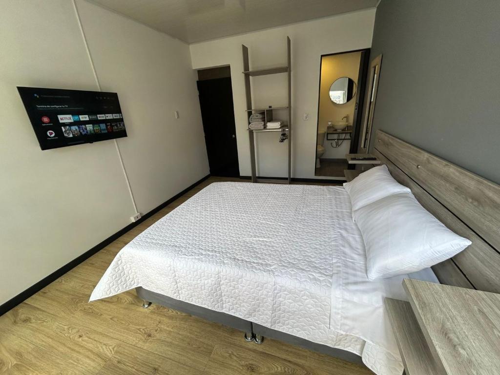 Postel nebo postele na pokoji v ubytování Hostel Quinta Camacho