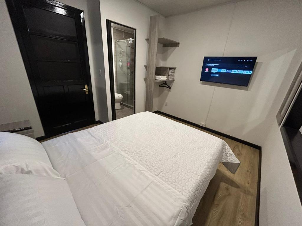 Postel nebo postele na pokoji v ubytování Hostel Quinta Camacho