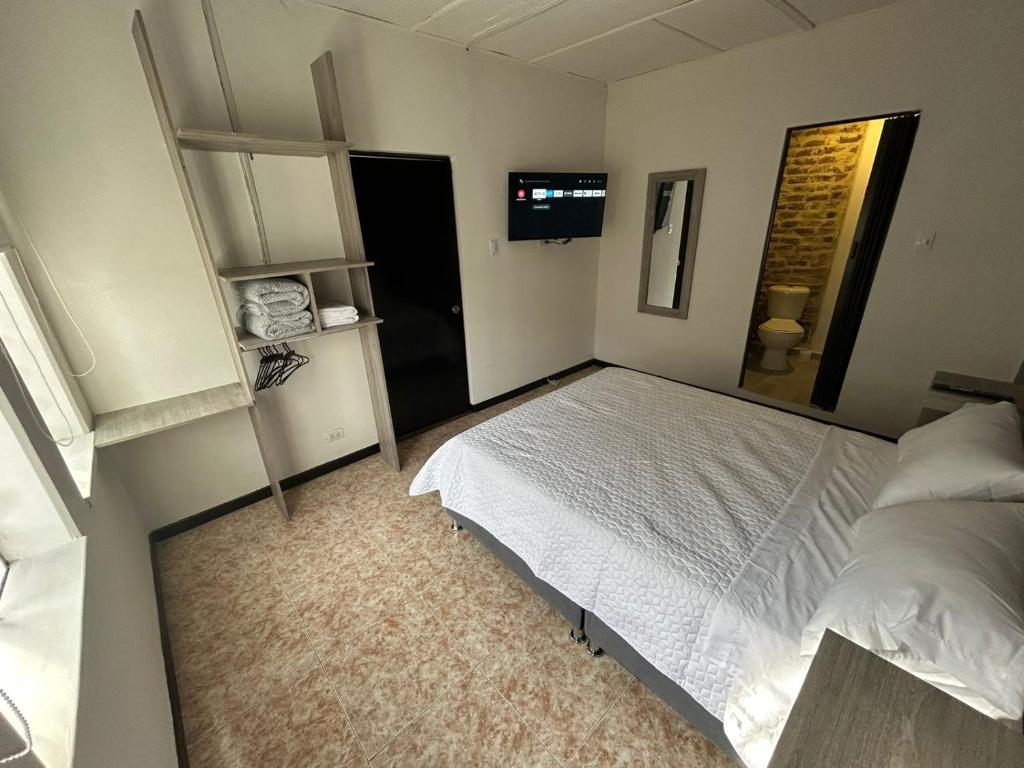 Postel nebo postele na pokoji v ubytování Hostel Quinta Camacho