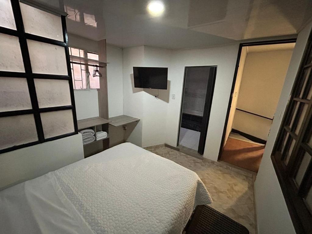 Postel nebo postele na pokoji v ubytování Hostel Quinta Camacho