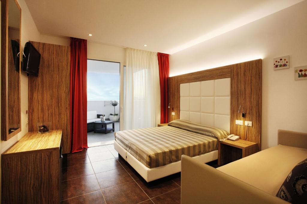 Säng eller sängar i ett rum på Hotel Fantasy