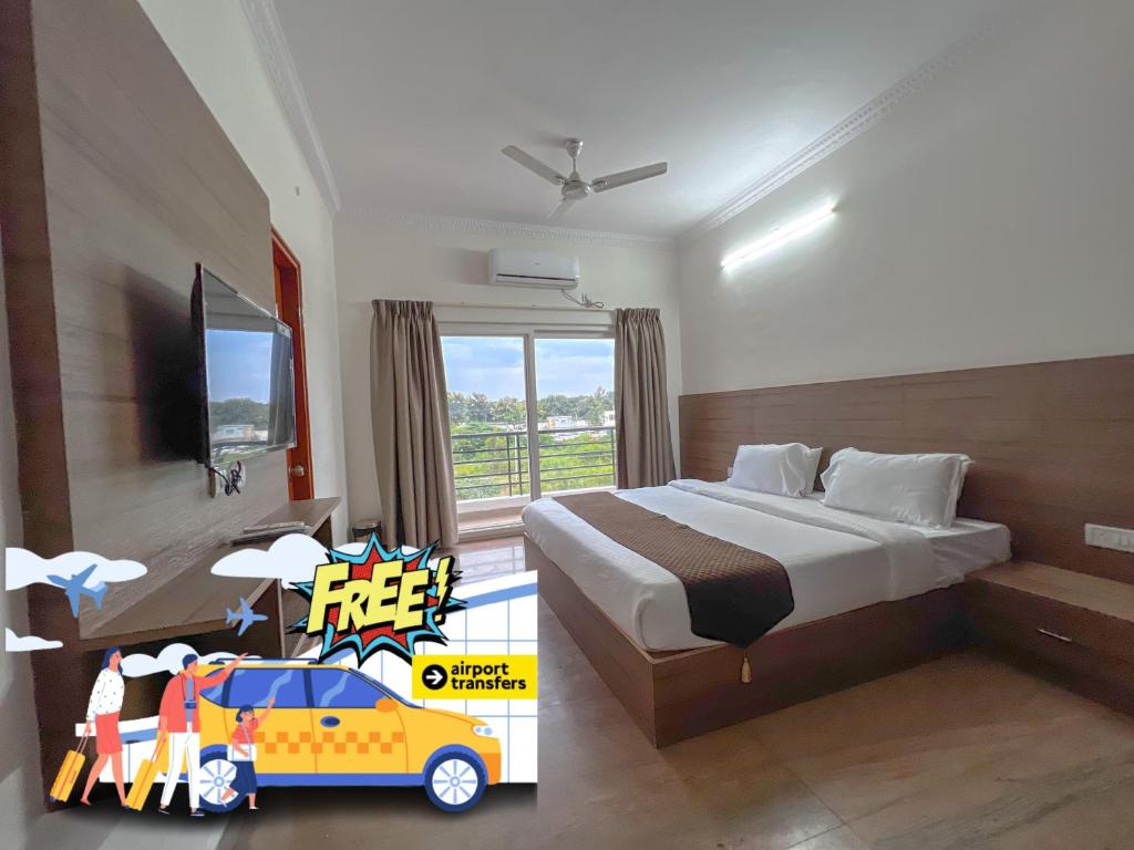 a bedroom with a bed and a window with a car on it at Hotel Elite By Agira Hotels-Free Airport Pickup or Drop in Yelahanka