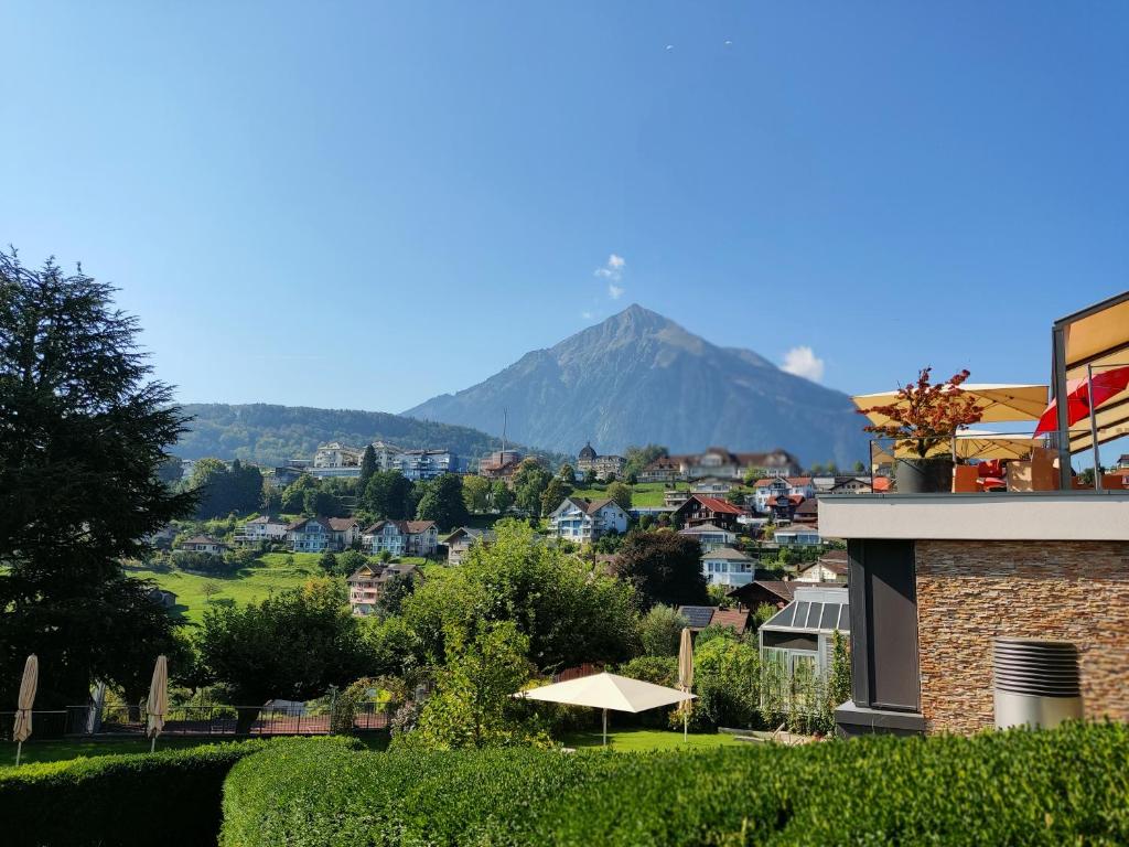 a view of a mountain from a house at THE BEST LAKE HOUSE -3 minutes to the train in Spiez