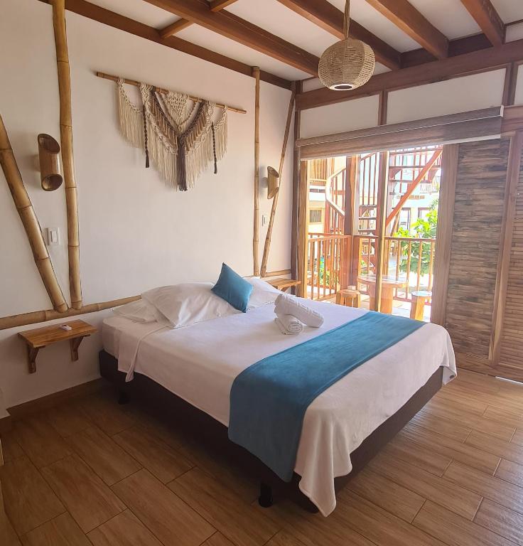 Postel nebo postele na pokoji v ubytování Intiquilla Hotel