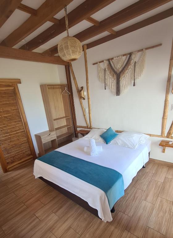 Postel nebo postele na pokoji v ubytování Intiquilla Hotel