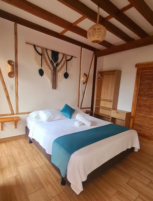 Postel nebo postele na pokoji v ubytování Intiquilla Hotel