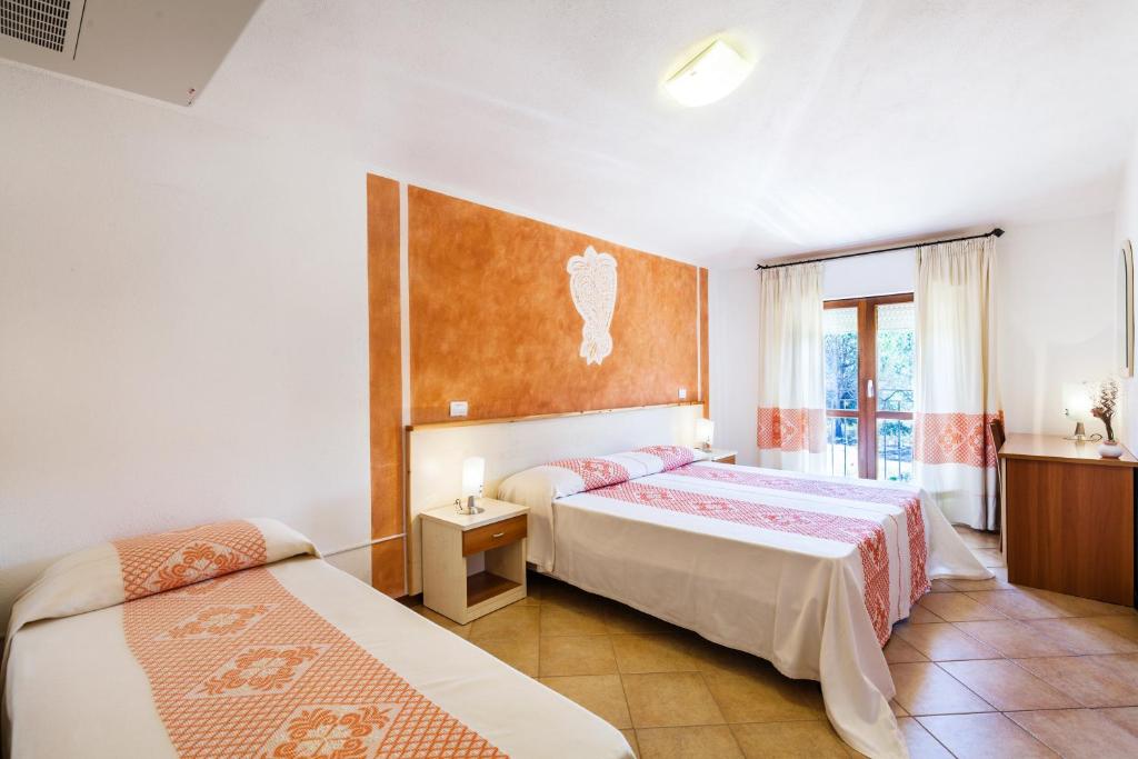 Postel nebo postele na pokoji v ubytování Hotel Petri Marini