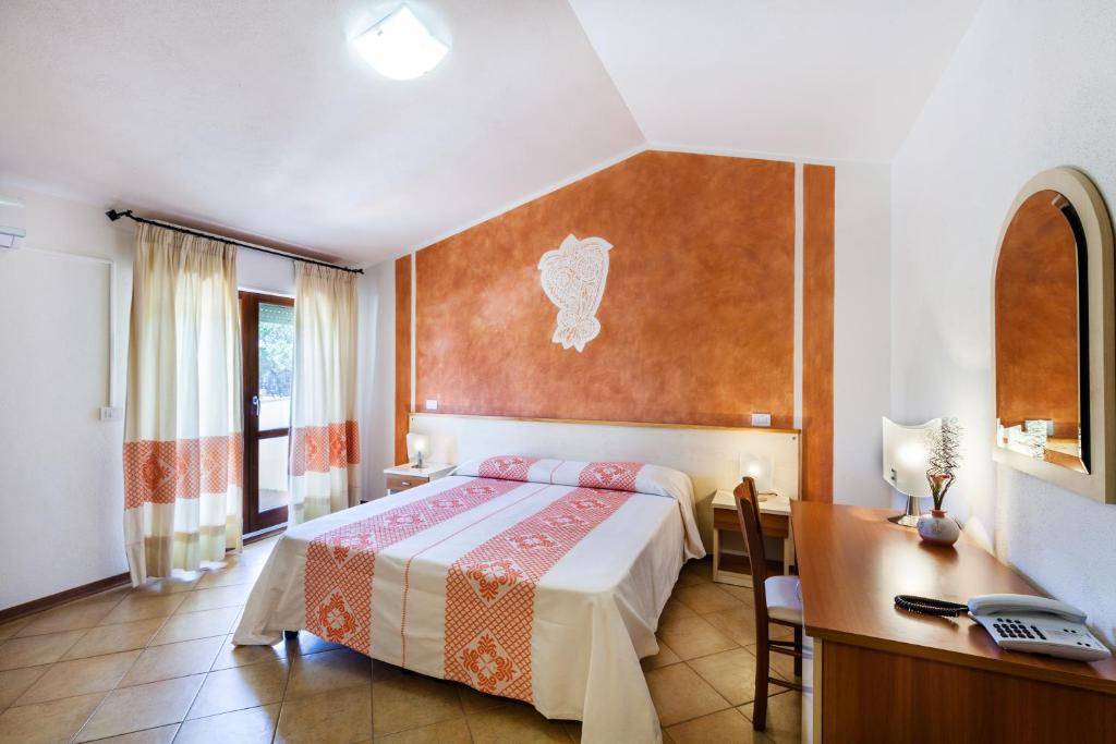 Postel nebo postele na pokoji v ubytování Hotel Petri Marini