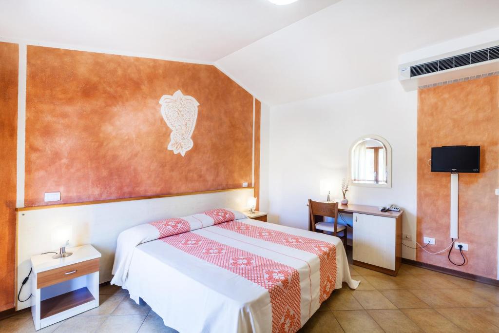 Postel nebo postele na pokoji v ubytování Hotel Petri Marini