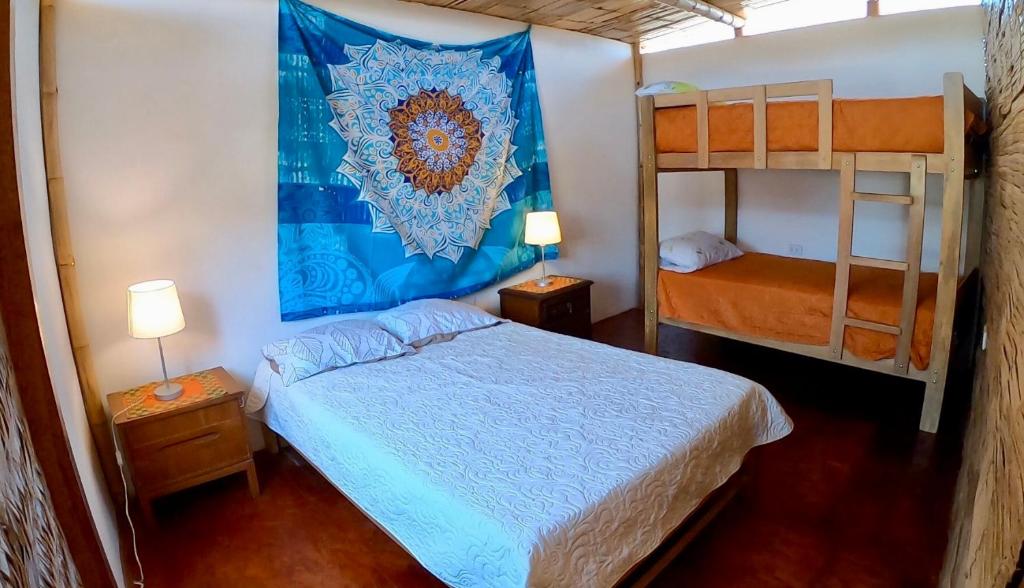 A bed or beds in a room at Casa Mauka Habitación múltiple