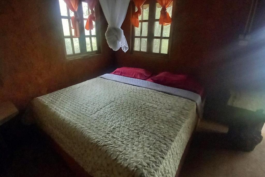 Postel nebo postele na pokoji v ubytování Doi PuMuen LAHU Homestay
