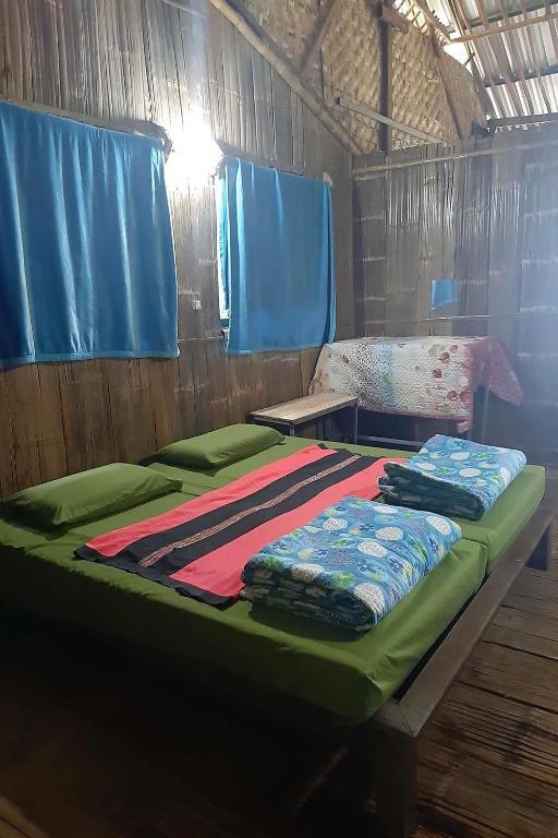 Postel nebo postele na pokoji v ubytování Doi PuMuen LAHU Homestay