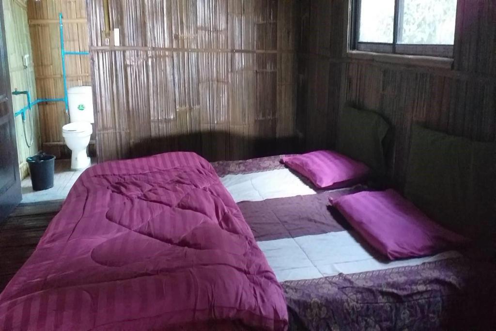 Postel nebo postele na pokoji v ubytování Doi PuMuen LAHU Homestay