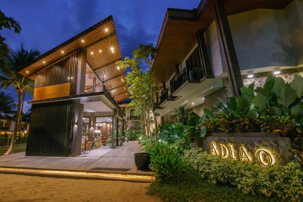 a house with a sign that reads adonia at Balai Adlao in El Nido