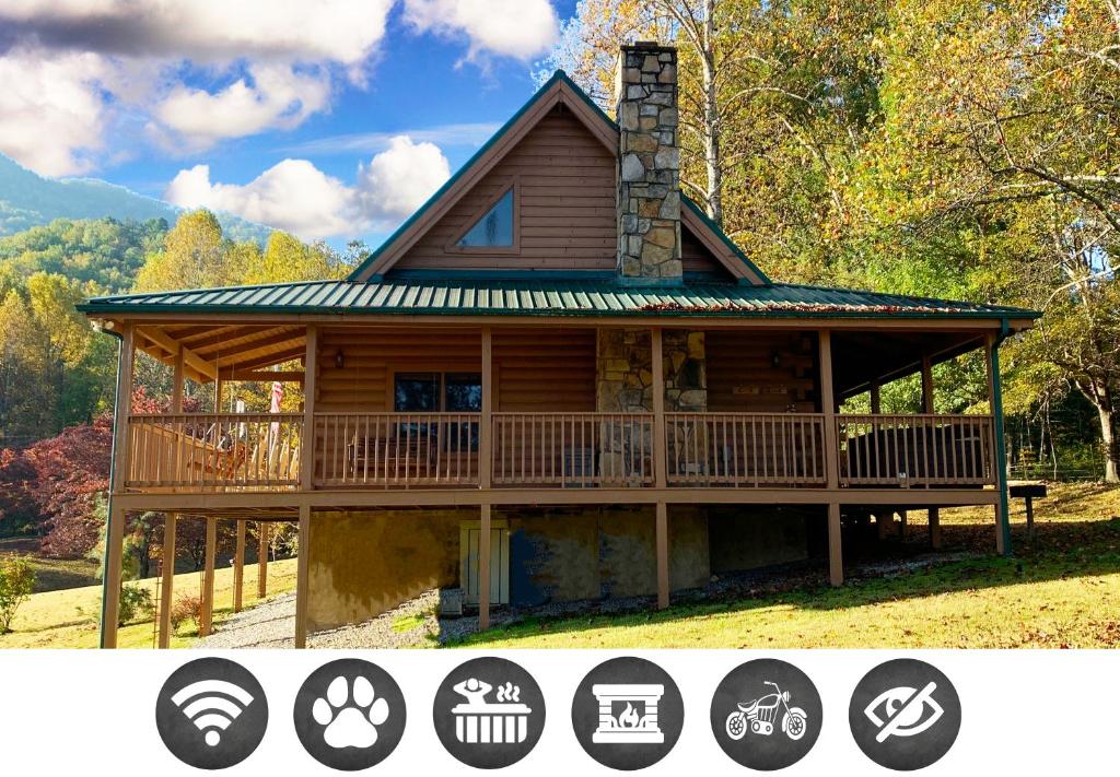 a large log cabin with a wrap around porch at A Dream Come True cabin in Sevierville