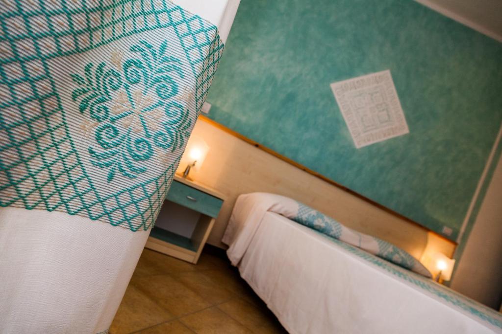 Postel nebo postele na pokoji v ubytování Hotel Petri Marini