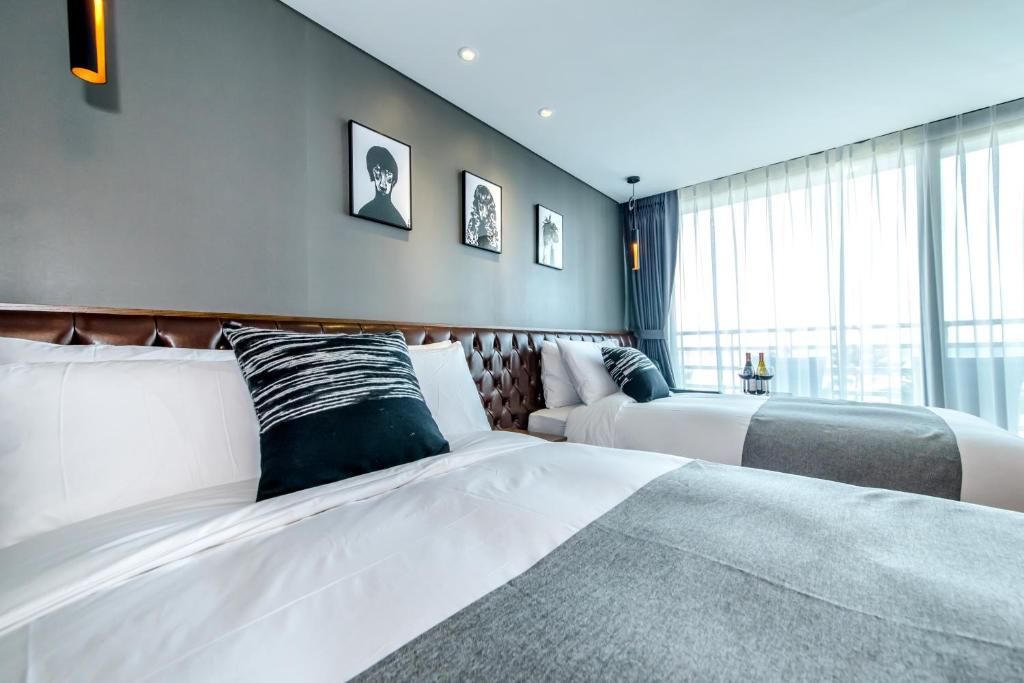 Postel nebo postele na pokoji v ubytování Marevo Beach Hotel