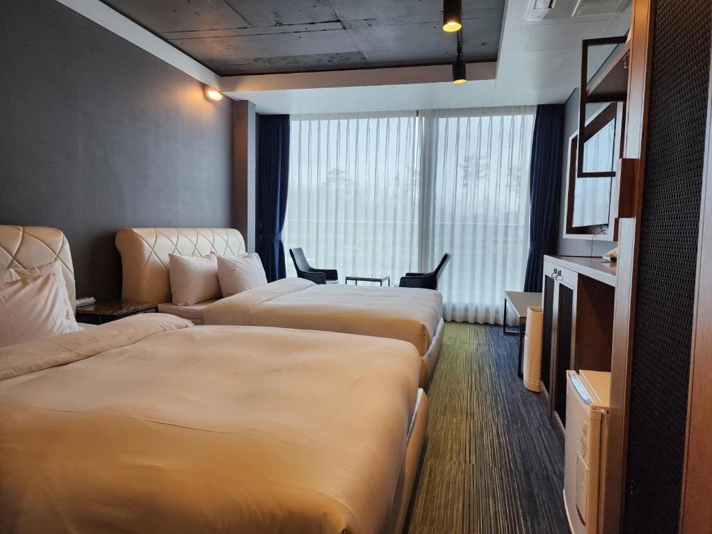 Postel nebo postele na pokoji v ubytování Marevo Beach Hotel