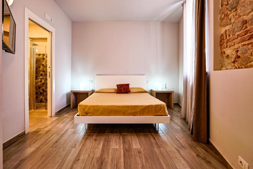 Postel nebo postele na pokoji v ubytování Le Suite