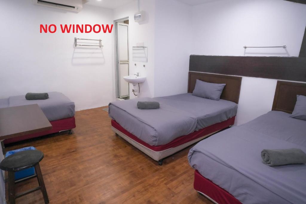 Postel nebo postele na pokoji v ubytování Heritage Inn