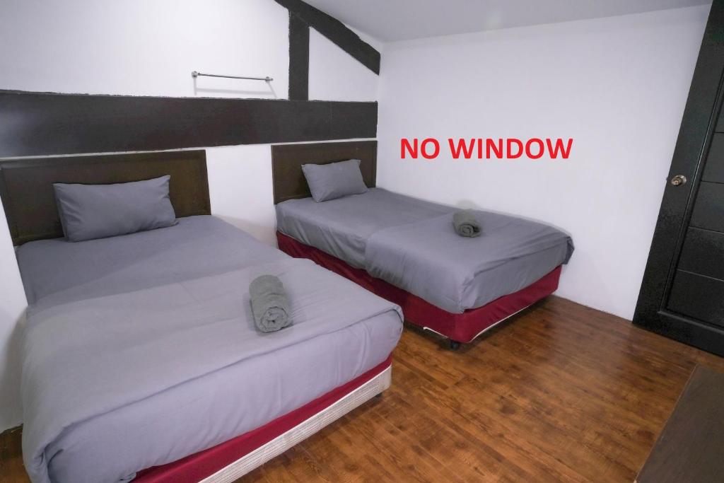 Postel nebo postele na pokoji v ubytování Heritage Inn