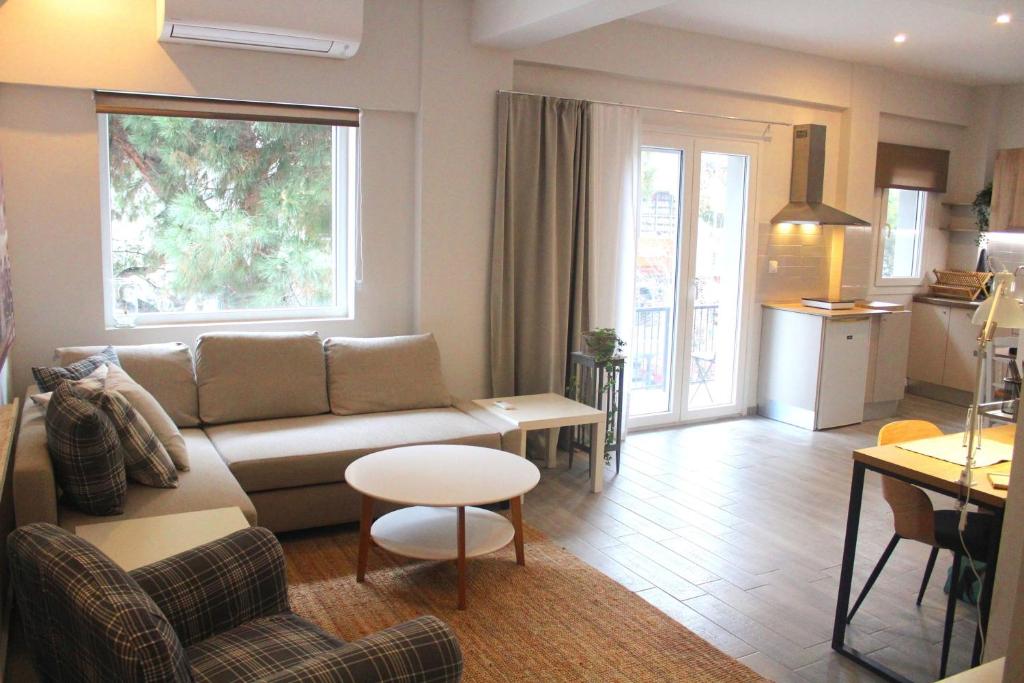 a living room with a couch and a table at City Center Apartment 1 in Alexandroupoli