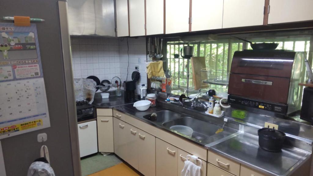 Kuchyň nebo kuchyňský kout v ubytování Guesthouse Oomiya base 大宮基地別荘