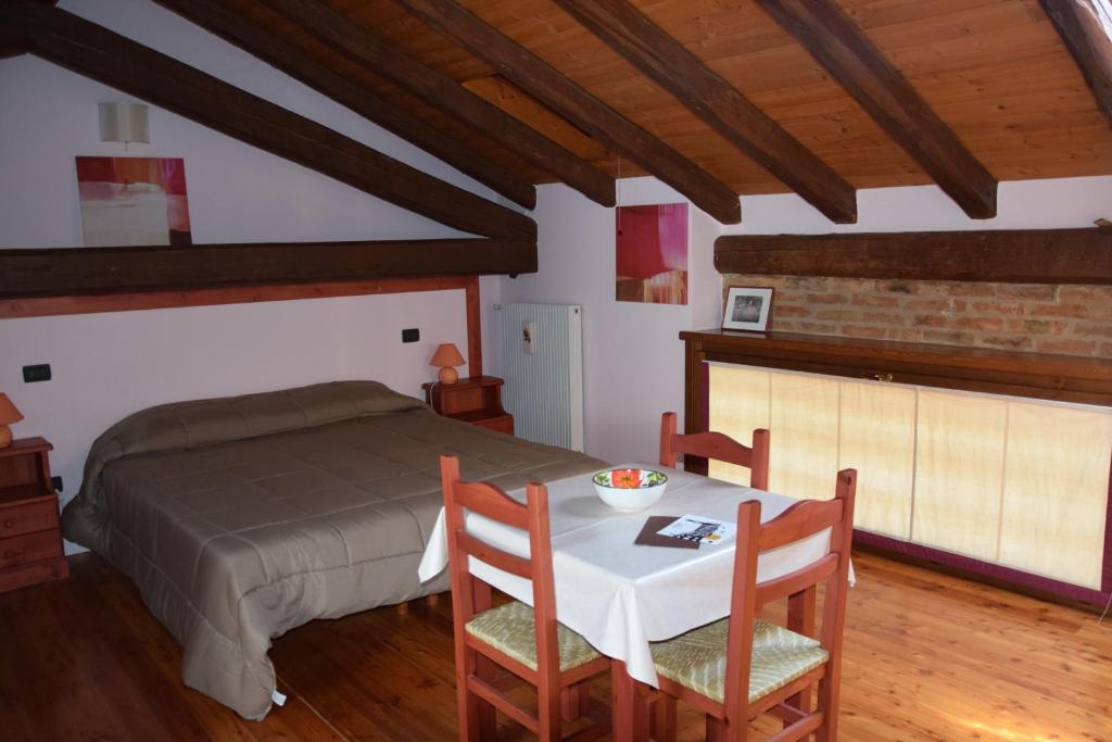 Postel nebo postele na pokoji v ubytování Agriturismo Domus Rustica