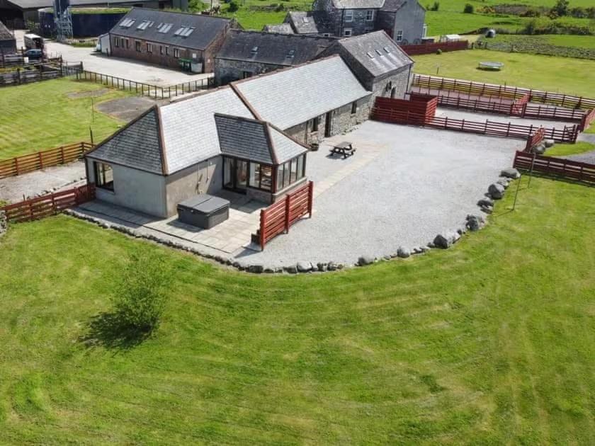 an aerial view of a building with a large yard at Middle Byre in Castle Douglas