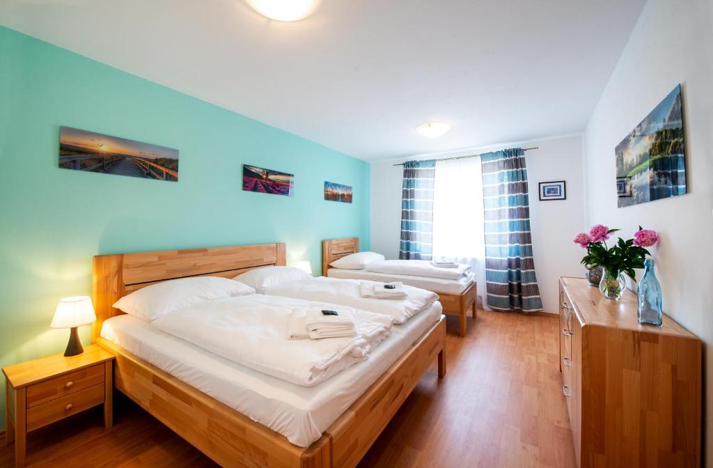 Postel nebo postele na pokoji v ubytování RELAX PARK Třeboň I