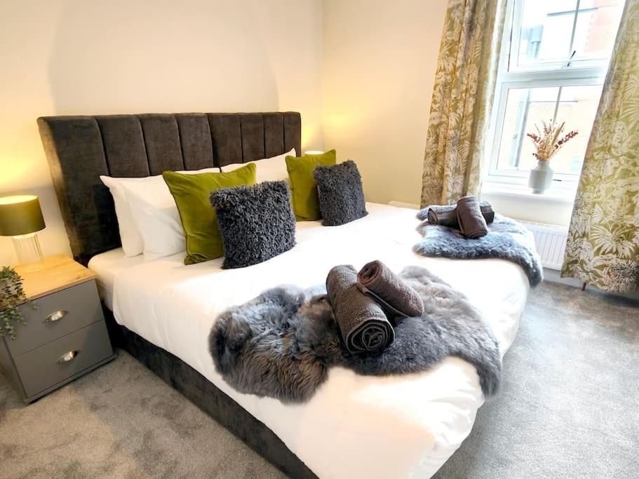 a bedroom with a large bed with a faux fur blanket at Carvetii - ANNE House Room 2 - Dbl bed First floor en-suite in Carlisle