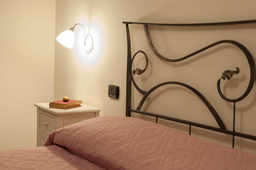 Postel nebo postele na pokoji v ubytování B&B Dimora di Girgenti