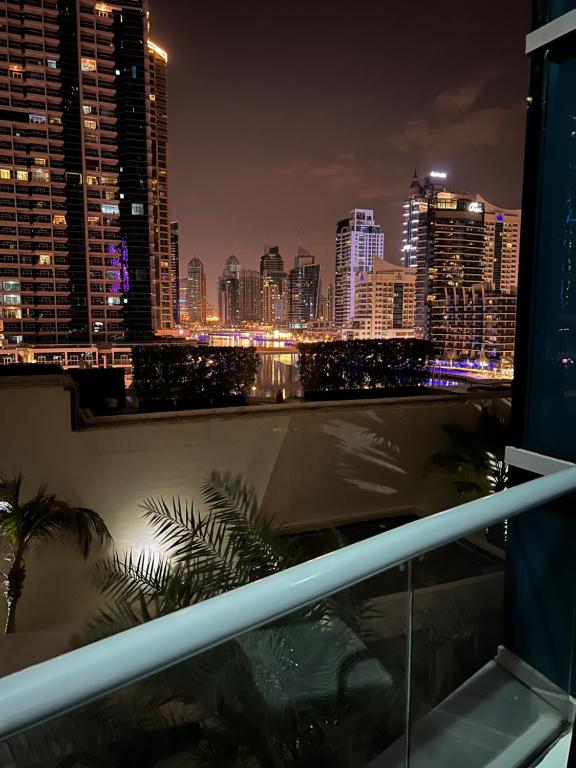 a view of a city skyline at night at Seaside, renewed poshy apartment on JBR in Dubai