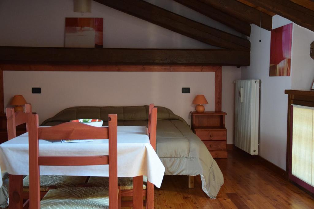 Postel nebo postele na pokoji v ubytování Agriturismo Domus Rustica